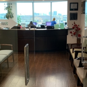 Modern and comfortable waiting room at NEXS Medical’s Bellaire Clinic with seating and natural lighting